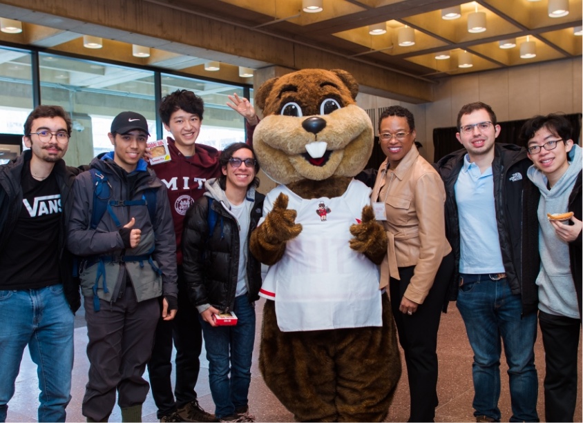 Chancellor Nobles with a group of students and the Tim the Beaver Mascot.