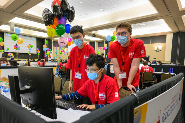 (From left to right:) Ziqian Zhong, MingYang Deng, and Anton Trygub work on their coding solutions. 
