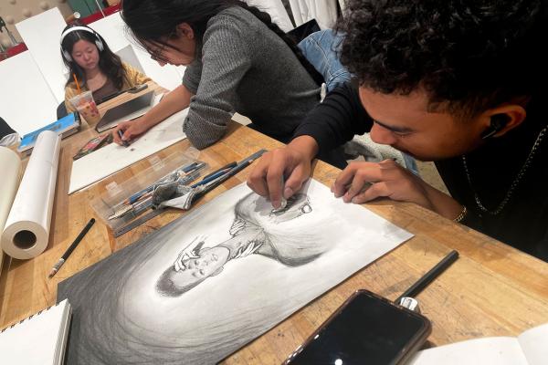 Senior Charles Williams, a computer engineering major, works on pieces he says depict stressors he was experiencing. “This class breathes back into you the creative and artistic expression that is too often lost as we grow up and mature,” he says.
