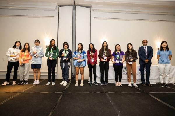 Left to right: Top scorers Sophia Zhang, Emily Yu, Heyang (Felicity) Ni, Olivia Xu, Miranda Wang, Catherine Xu, Shruti Arun, Hannah Fox, Selena Ge, and Jessica Wan; Advantage Testing president and founder Arun Alagappan, and emcee and MP4G alumna In Young Cho. 