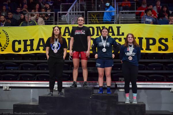 National champion Sarah Sams (second from left) atop the winners' podium at the NCWA National Championships. Sams also received all-America honors for her performance.