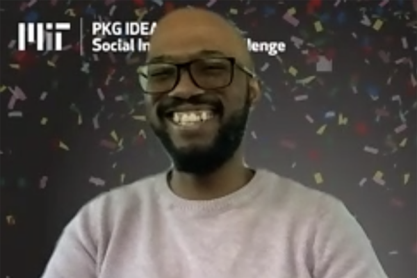 MIT graduate student Thandolwethu Dlamini accepts a grant on behalf of his IDEAS team, TKI.