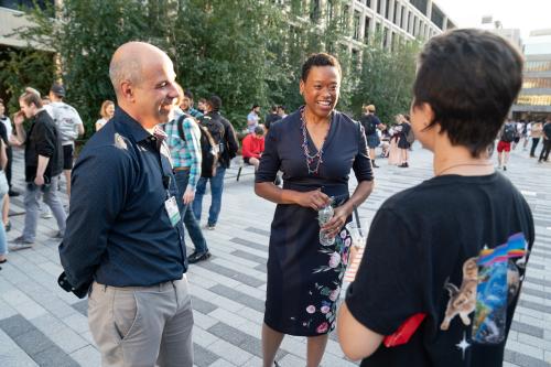 Chancellor Melissa Nobles (center) meets and greets community members at the Institute community social hosted by President L. Rafael Reif.