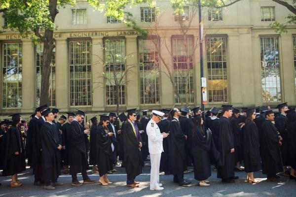 MIT graduates make their way to Killian Court via Massachusetts Avenue during the 2017 Commencement ceremonies.
